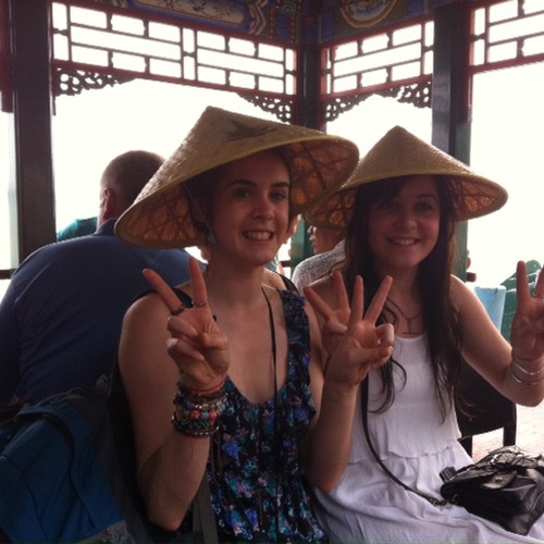 Harriet, Emma Cropper with their traditional hats on the boat