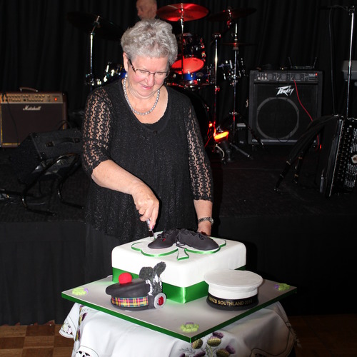 Jean Macnicol cutting the Conference cake