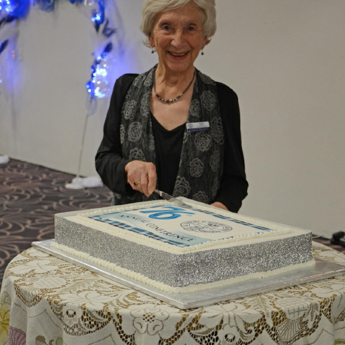 Patron & Life Member  Beckie Rout - cutting cake