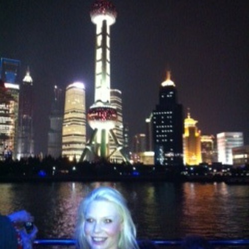 Nicole harding on cruise - Huang Pu River with Pearl Tower in background