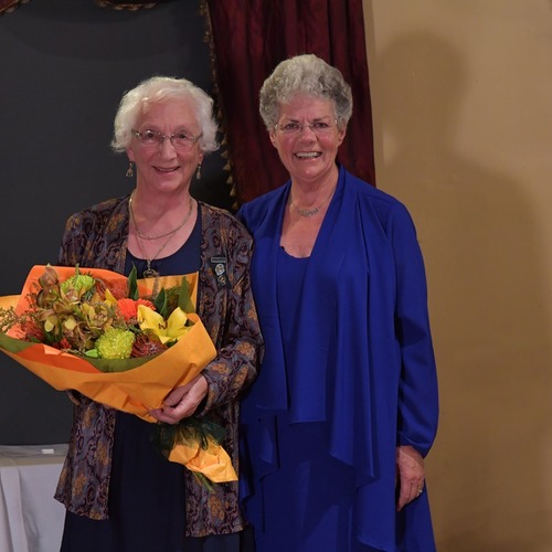 Beckie Rout receiving her 65 year bar from President Annetta Cowie